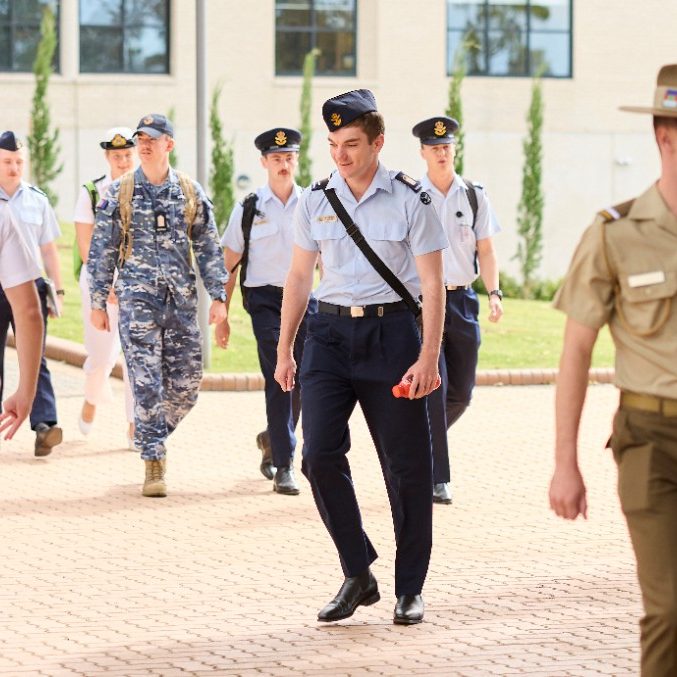 Students in uniform walking through the UNSW Canberra campus Students in uniform walking through the UNSW Canberra campus