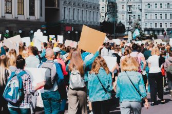 Young people marching on the street protest. Take a part in a march. Rally. Movement. Protest in the city Social Policy Research Centre