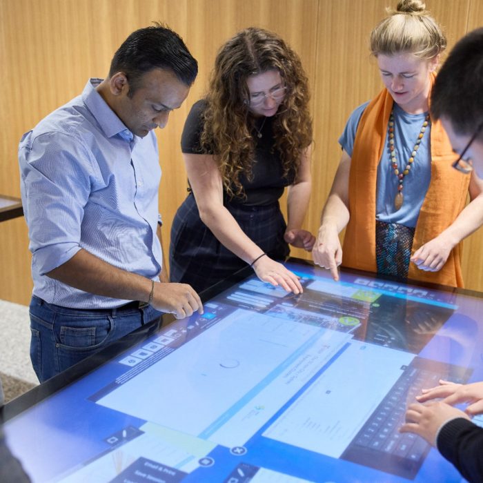 Students using technology in the City Futures Lab at the School of Built Environment