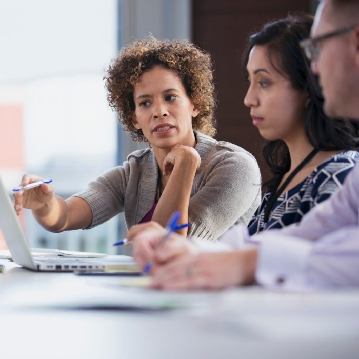 Peers having serious conversation in classroom