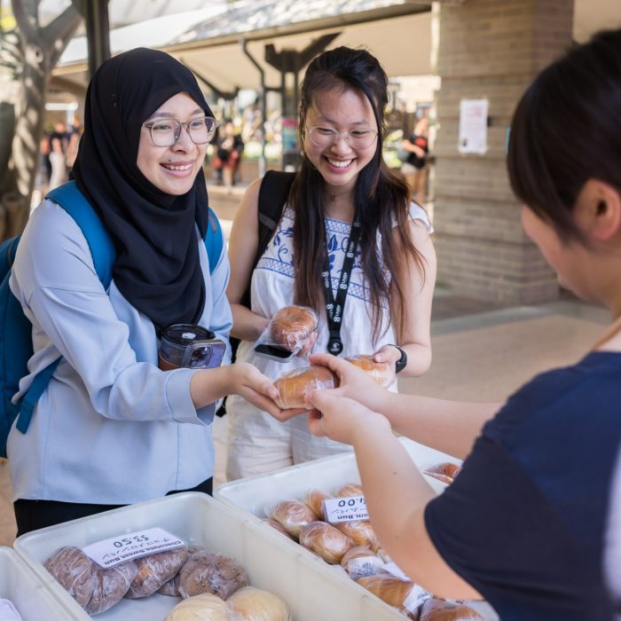 Two students buying food