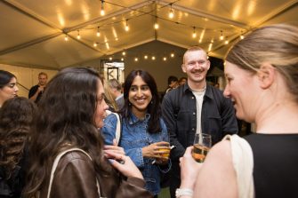 Creative Conversation guests enjoying networking drinks in the Art & Design courtyard