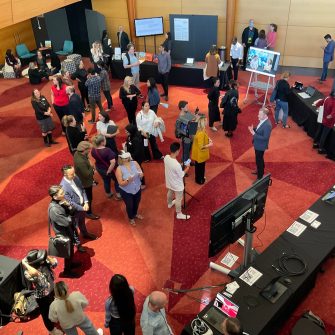 A group of people at an exhibition showcase