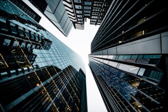 Looking directly up at the skyline of the financial district in central London