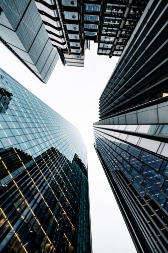 Looking directly up at the skyline of the financial district in central London