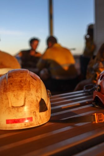 Miners underground inspecting work in progress at a mine site in Australia