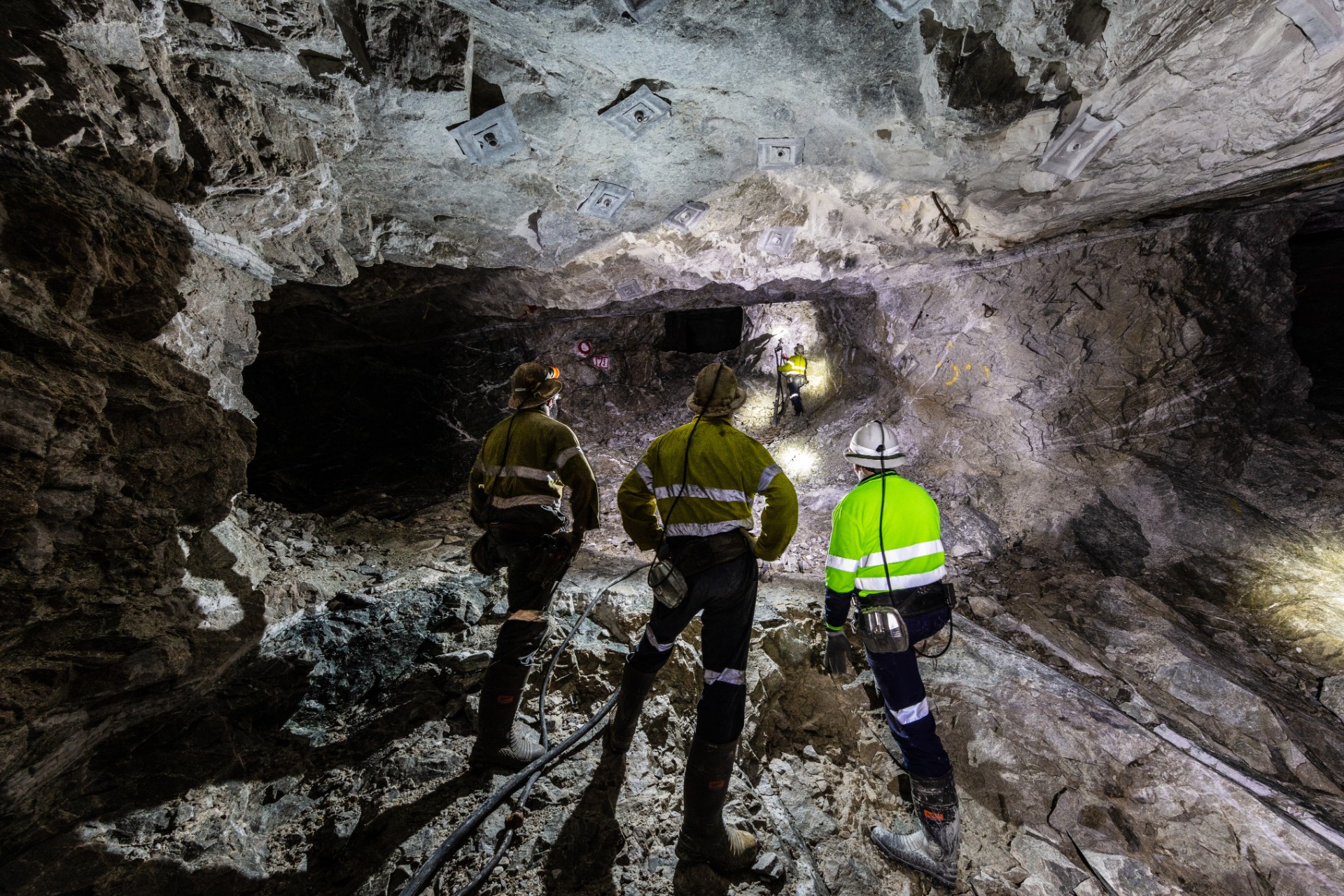 Miners underground inspecting work in progress at a mine site in Australia