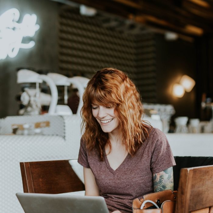 Woman sitting on a chair using a laptop