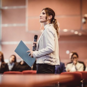 Business People Listening to the Speaker at a Conference