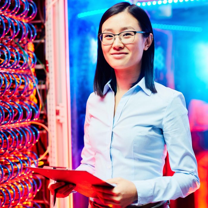 A woman standing next to wires