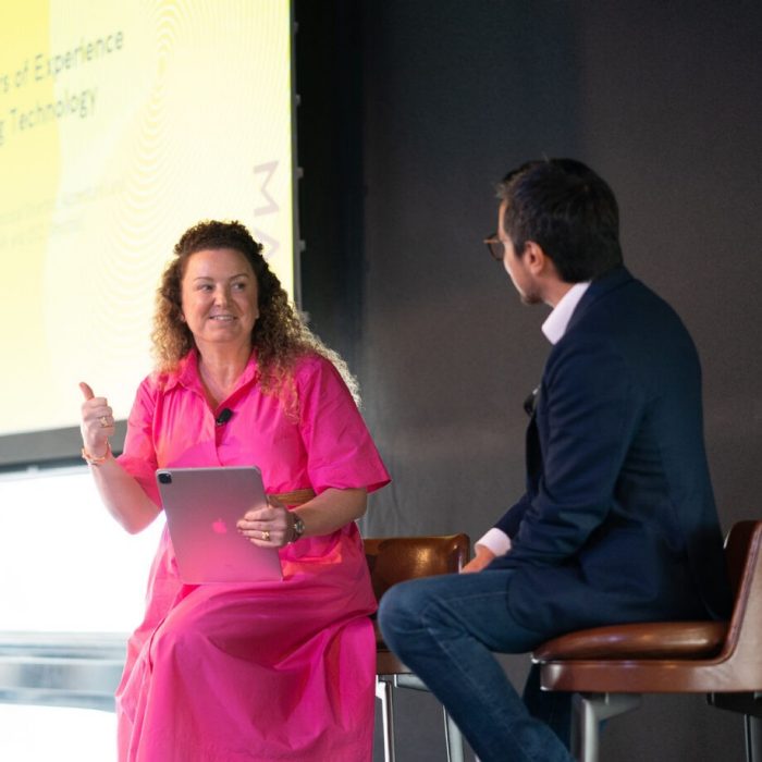 Photo of two people presenting at UNSW Conference