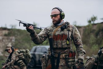 A group of Ukrainian Air Intelligence soldiers practising with a drone.