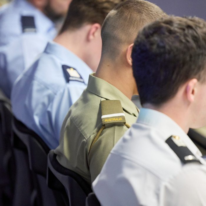 Close-up from behind of students in lecture