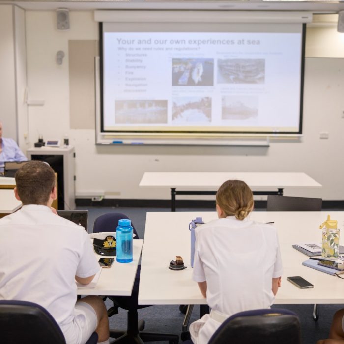 ADFA Canberra UNSW students looking at classroom screen with lecturer