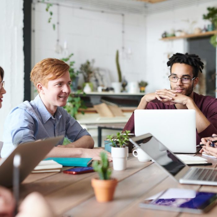 Group of workers around a desk