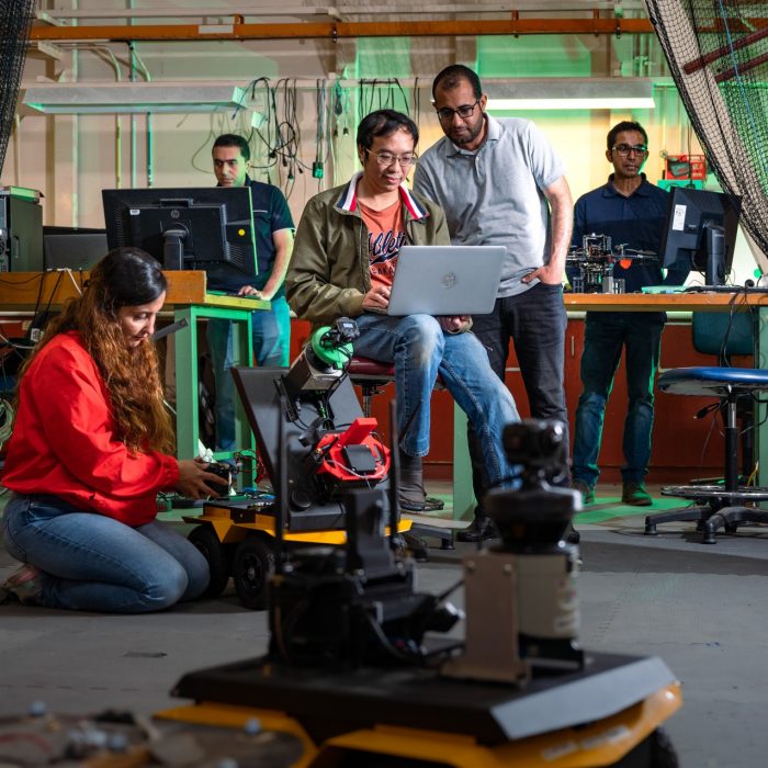 Robotic Engineers photographed in the robotics lab in Building 18 on campus.

L to R: Dr Shadi Abpeikar, Dr Essam Debie, Dr Phi (Vu) Tran, Mr Ammar Mahdi (PhD Candidate), Dr Asanka Perera,