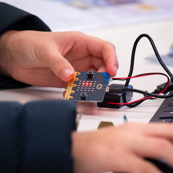 Close up of person holding electrical item