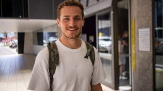 A student  outside a building on UNSW Kensington Campus