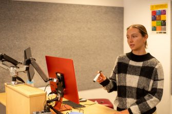 Students doing presentations in a classroom on Paddington Campus