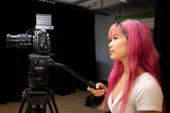 Two students working in a photography studio on Paddington Campus