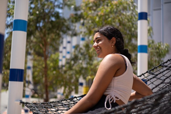 Students relaxing on the hammocks at Alumni Park on the UNSW Kensington Campus