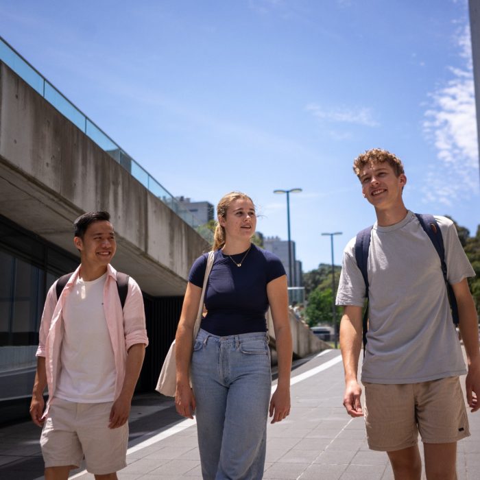 Three students chatting while walking on UNSW Kensington Campus