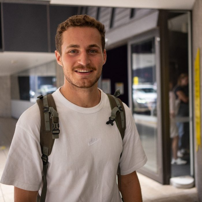 A student  outside a building on UNSW Kensington Campus