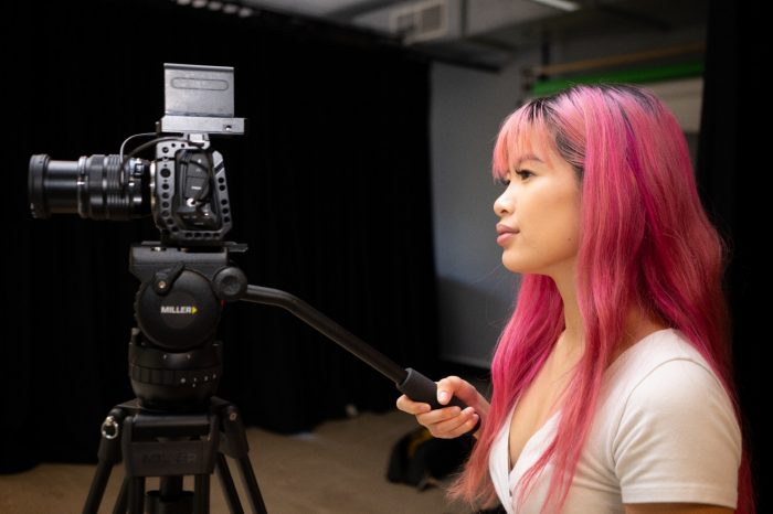 Two students working in a photography studio on Paddington Campus