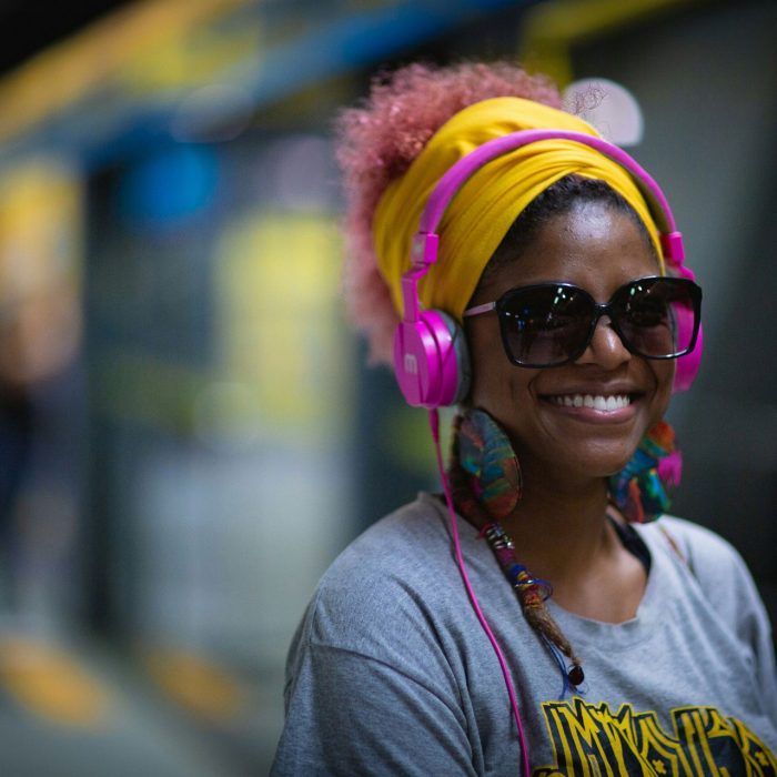 Happy person waiting for a train