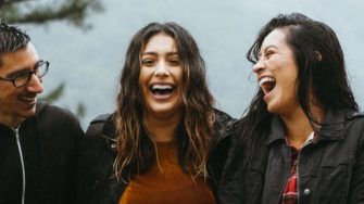 Happy people trying to avoid the rain