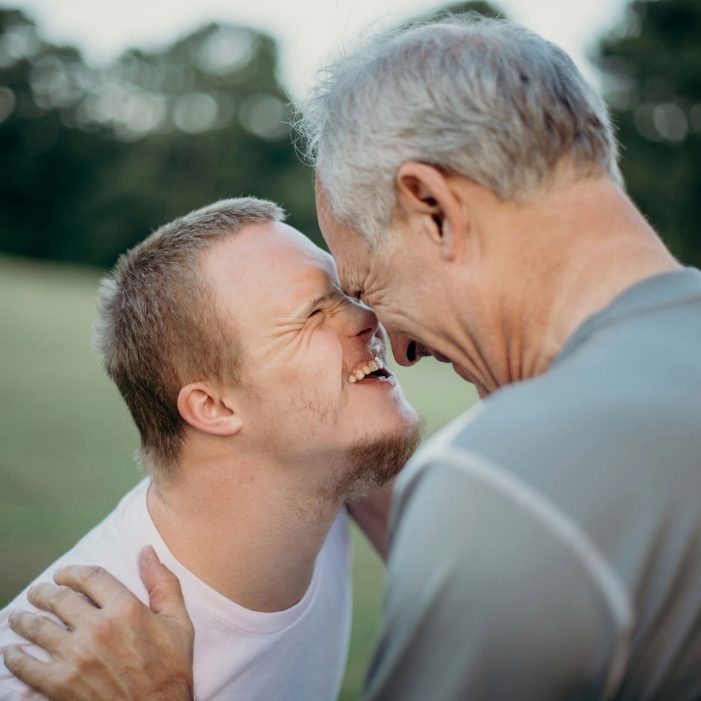 Sharing a moment on a grass field