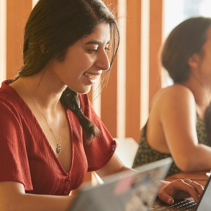 Students and teachers in business school computer lab