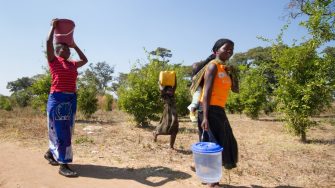 Women in Tanzania carrying water
