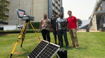 Group of men with scientific equipment 