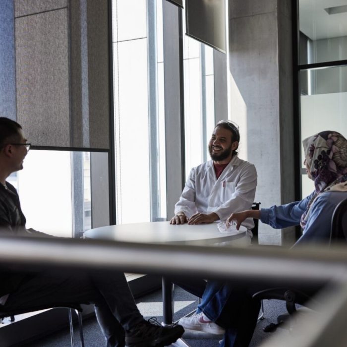 Alumni gathering in a meeting room