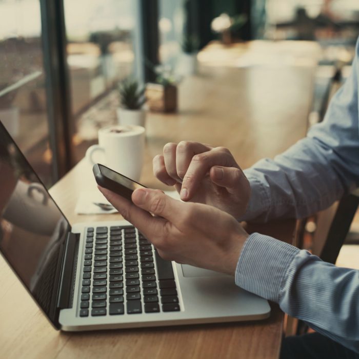 social media, closeup of hands holding smartphone in cafe, banking online, businessman with mobile internet