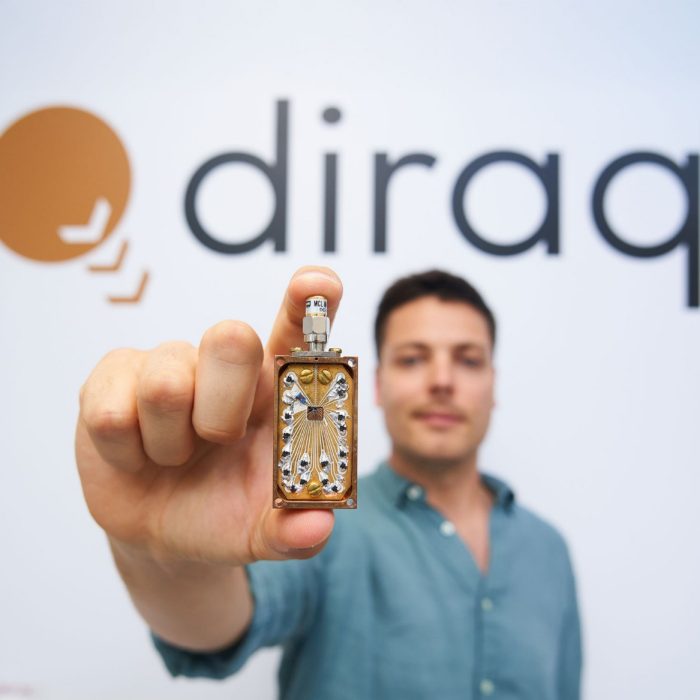 Diraq engineer Nard Dumoulin-Stuyck holding a Diraq chip