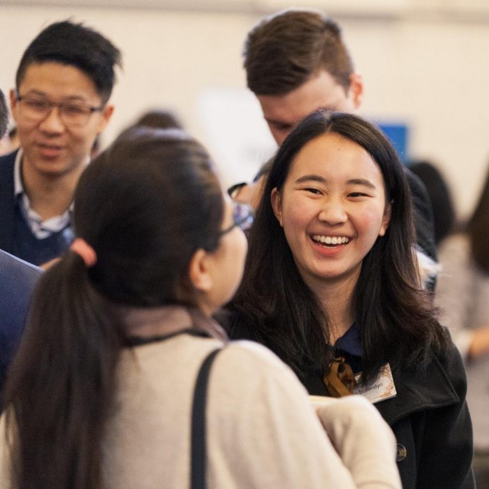 Alumni talking at an event