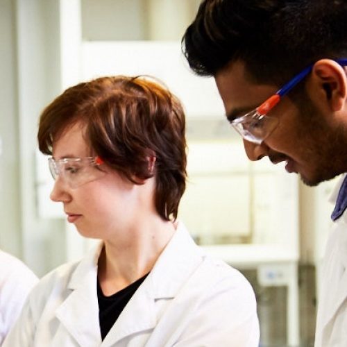 UNSW engineering student wearing safety gear and working in lab