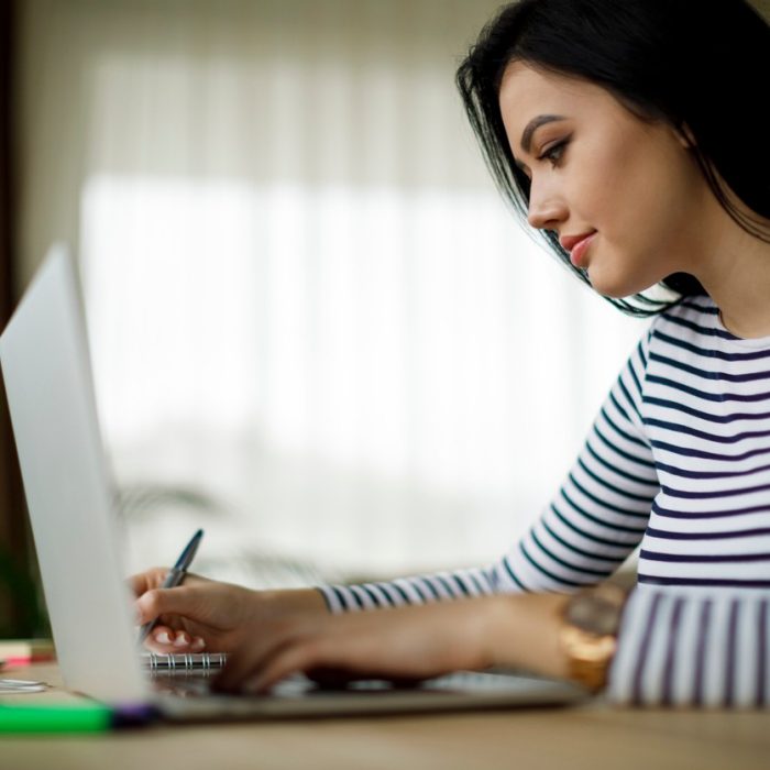 Young woman working at home