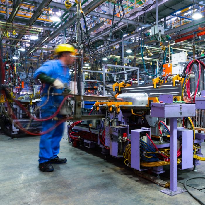 Modern automatic automobile manufacturing workshop. A busy car production line. Industrial scenery background.