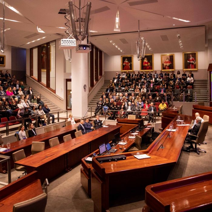 Wide shot of the audience and speakers at the Mason Conversation event in 2019