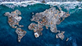 Concept environmental with plastic pollution ocean and human waste. Continents earth are made up of garbage, surrounded by water.