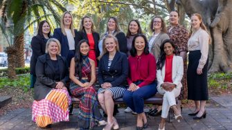 Portrait image of group of 13 women posing for a photo as representatives for Pathways to Politics for Women