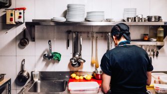 exploited immigrant cook working alone in a kitchen 