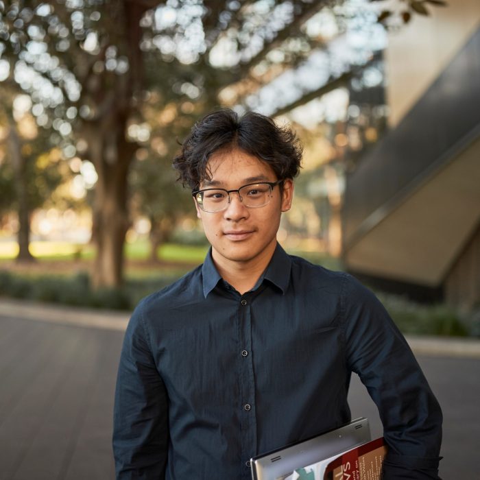 Law student portrait outside, in front of Law Building