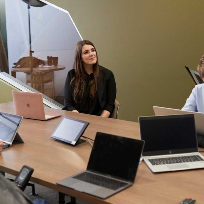 Students in Law PhD Room talking to other students with remote access via internet.