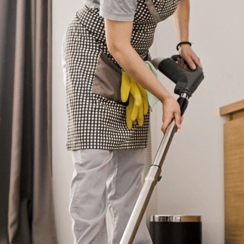 Person vacuuming banner image