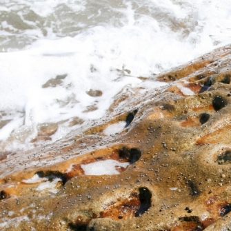 Water hitting a rocky shore