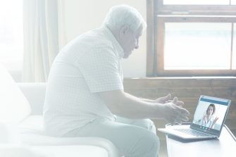 Photo of senior citizen video chats with doctor